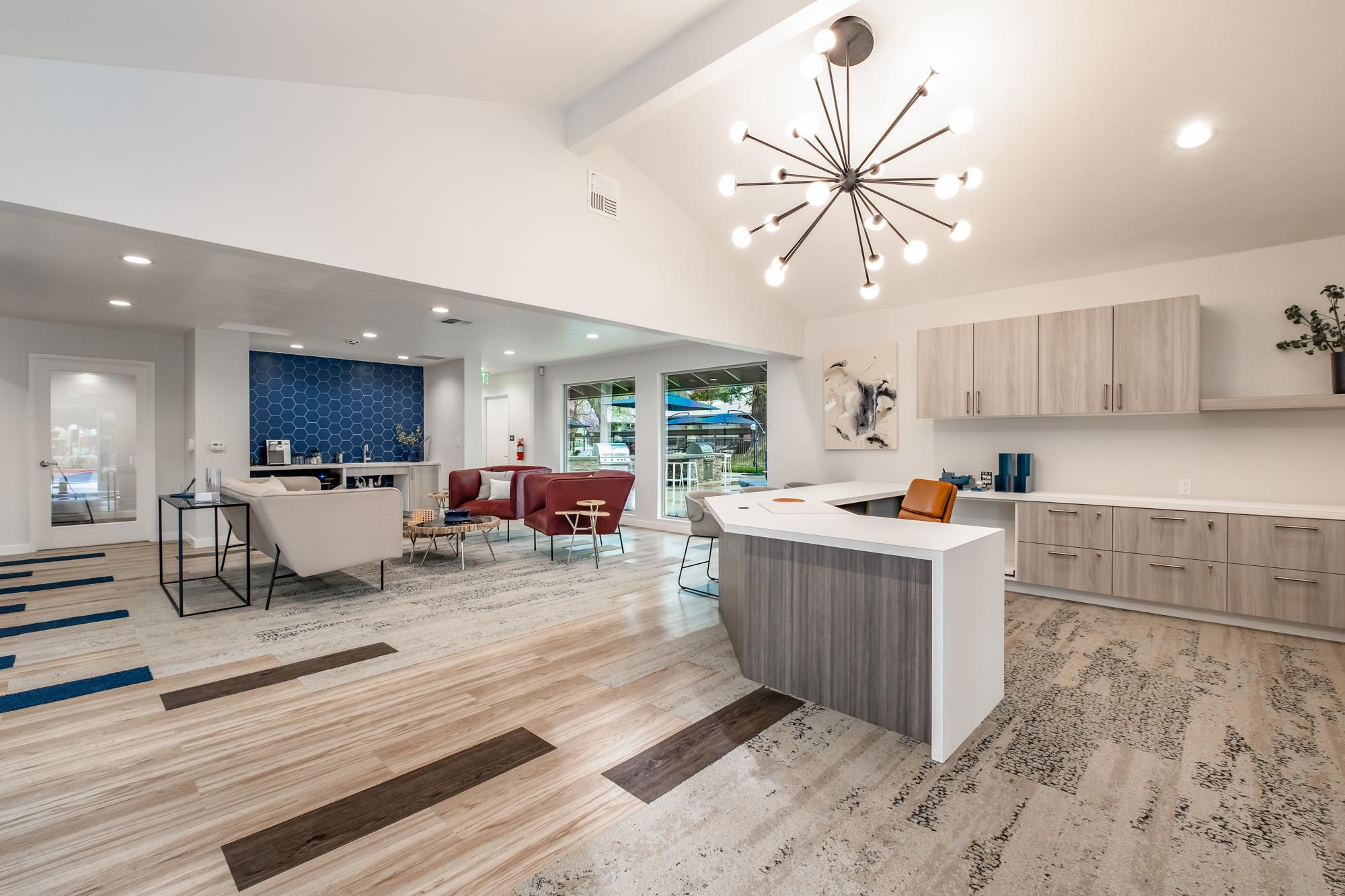 Renovated leasing office and clubhouse with vaulted ceilings and modern lighting